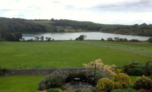 The view from our room of the lake with a church ruin in the background.