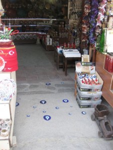 Protection against the evil eye embedded in a shop door way