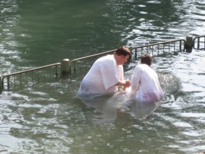 A woman being baptised