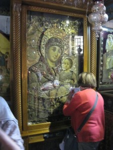 Religious icon that was kissed for blessing.  Many people held shawls and paper to the icon to absorb the blessing.