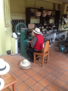 First the brim of the generic hat is flattened in a machine.