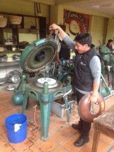 Then the hat is put in a press with an aluminum mold.  Using steam the hat is formed to the classic shape.