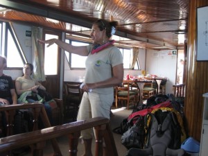 Our guide, Sara and the eating area behind (and our mountain of backpacks on the first day)