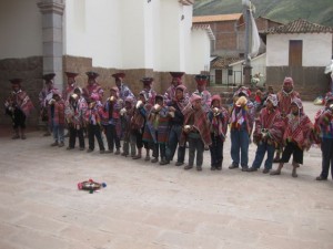 Procession of conch-shell blowing locals ending at the church