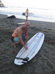 Steve waxing my board up well.  One excuse gone for why I fell off so much!