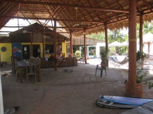 Lounge area - eating tables on the left, couches and bar in front and the pool behind on the far right.  And lots of hammocks!