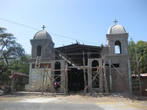 Unfinished church holding mass